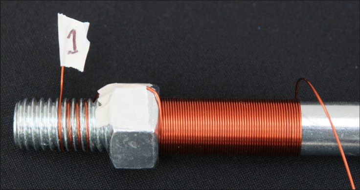 Begin wrapping the coil at the hex nut, leaving some extra wire at the beginning of the coil.
